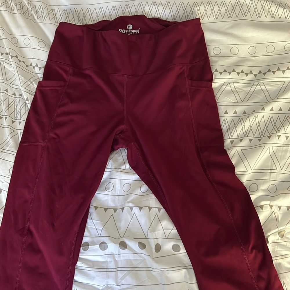 Used good condition burgundy leggings with pockets.